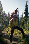 Smokejumper carrying gear in the Sky Lakes Wilderness by Douglas Beck
