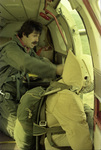 Smokejumper in door of aircraft with spotter Tom Emonds by Douglas Beck