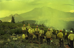 Smokejumpers wait for a fire retardant by Douglas Beck