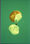 Smokejumper releasing reserve during parachute training by Douglas Beck