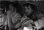 Three smokejumpers in a helicopter by Douglas Beck