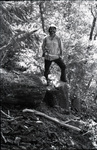 Doug Beck standing on a stump by Douglas Beck