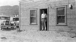 Anderson and the original jail in Grand Coulee by unknown