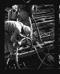 Workers pouring concrete into Grand Coulee Dam by Hubert Blonk