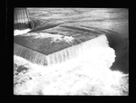 Water flows over a section of the partially constructed Grand Coulee Dam by Hubert Blonk