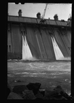 Water spills down the front of the partially constructed Grand Coulee Dam by Hubert Blonk