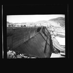 People and automobiles gathered atop the partially completed Grand Coulee Dam by Hubert Blonk