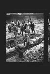 Workers laying sandbags by Hubert Blonk