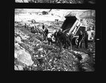 Workers shovel dirt behind a cofferdam by Hubert Blonk