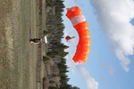 20. Smokejumper with feet on ground after landing using a CR-360 parachute by Ted Corporandy