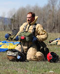 27. Smokejumper on ground after FS-14 practice jump by Ted Corporandy