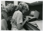 Woman and partner operate computer at Eastern Washington University by Eastern Washington University