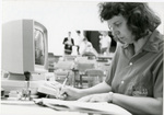 Woman works at a computer at Eastern Washington University by Eastern Washington University