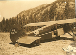 Smokejumper airplane in a field in Montana by unknown