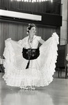 Ballet Folklorico dancer posing with dress raised at Eastern Washington University by Publications, Eastern Washington University