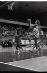 Eastern player shoots a lay up against Idaho State by Eastern Washington University. Publications
