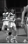 Lisa Comstock bringing the ball up court by Eastern Washington University. Publications