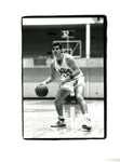 Greg Olson dribbling the basketball by Eastern Washington University