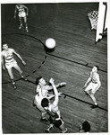 Eastern basketball player contests a shot attempt by Eastern Washington University