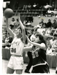 Eastern basketball player grabs a loose ball by Eastern Washington University