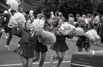Cheerleaders in homecoming parade by Eastern Washington University