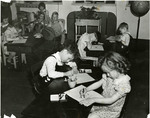 Art class in which students color with pastels by Eastern Washington College of Education