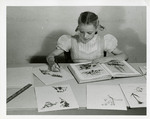 Art project by a girl identifying pressed flowers by Eastern Washington College of Education