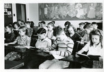 Singing lesson with a class of students by Eastern Washington College of Education