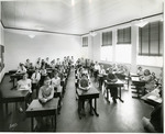 Students watch their teacher with their hands folded on their desks by Arthur T. Lacey and Eastern Washington College of Education