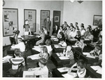 Adults observe a classroom of students by Eastern Washington College of Education