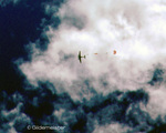 Two smokejumpers exit airplane by Jerry Gildemeister