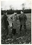 Captain Gibbons and other officers standing in a field during a photo shoot by Robert Gillette