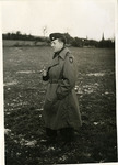 Major Barney Oldfield standing in a field during a photo shoot by Robert Gillette