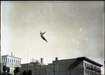 Acrobat soars above a crowd in downtown Spokane by unknown