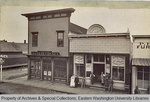 Bank of Cheney and L. Walter's Harness Shop by Unknown