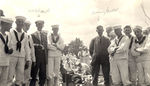 L.H. Brown and Jimmy Hoag from the National Parks Highway Association tour are standing with a group of naval cadets by Frank W. Guilbert