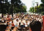 Crowd listening to speaker in front of the California state capitol building by Carlos Maldonado