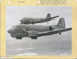 Two 555th Parachute Infantry troop carriers in flight by United States. Army Air Forces