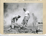 555th Parachute Infantry troopers shovel near smoky site by Edgar W. Weinberger and United States. Army Air Forces