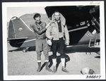 Jump jacket on Virgil Derry before Stinson Reliant by Harold C. King