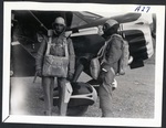Chet Derry and Virgil Derry suited up near Stinson Reliant by Harold C. King