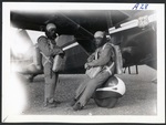 Chet Derry, Virgil Derry suited up near Stinson Reliant by Harold C. King