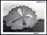 Parachute inflated on ground by unknown