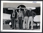 Four in front of Stinson Reliant by unknown